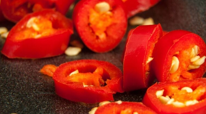 chopped cut chili peppers showing seeds
