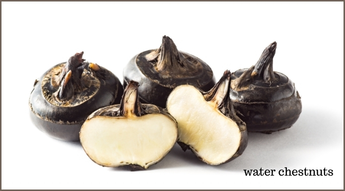 whole water chestnuts and cut open water chestnut