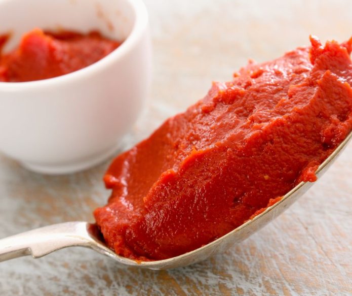 tomato paste in spoon