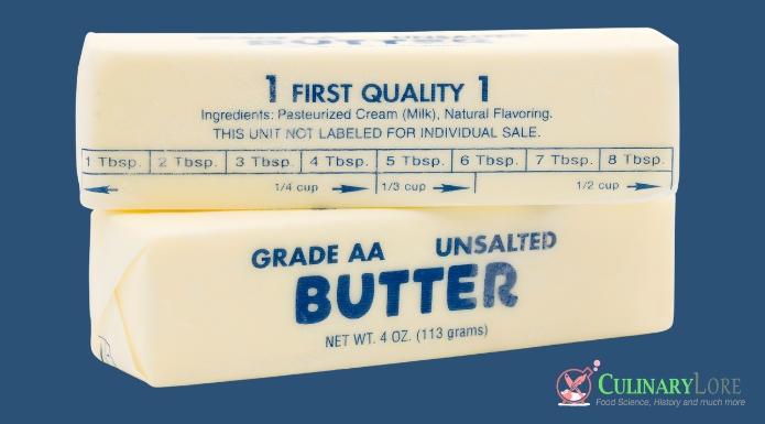 Sticks of butter in wrapper showing measurement amounts
