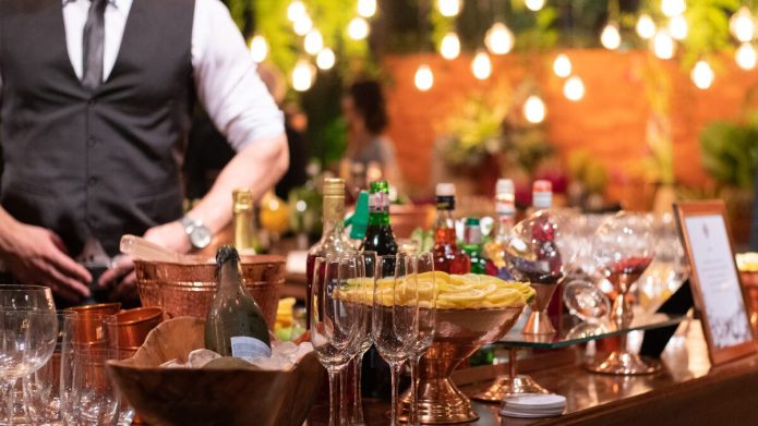 bartender working at open bar at wedding event