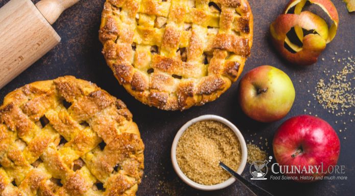fresh apple pies, whole apples, and brown sugar