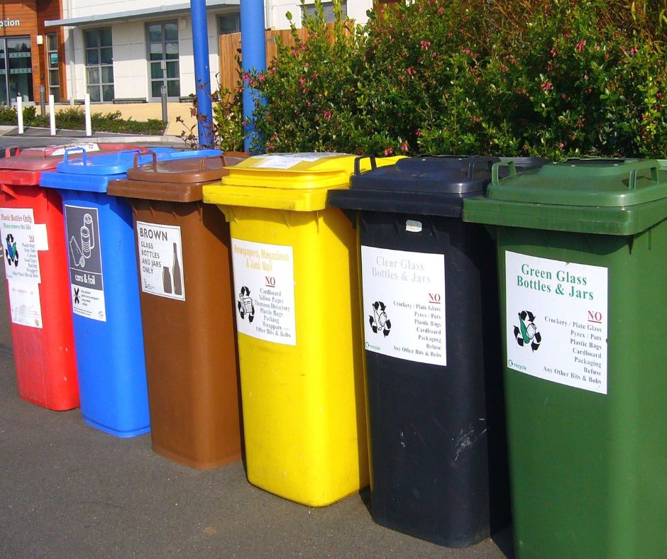 collection of recycling bins for various materials