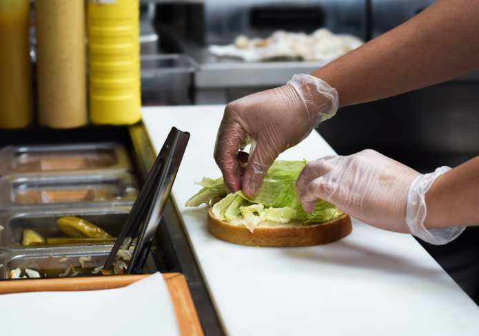 making sandwich for customer order