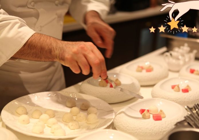 Michelin star chef carefully plating a dessert