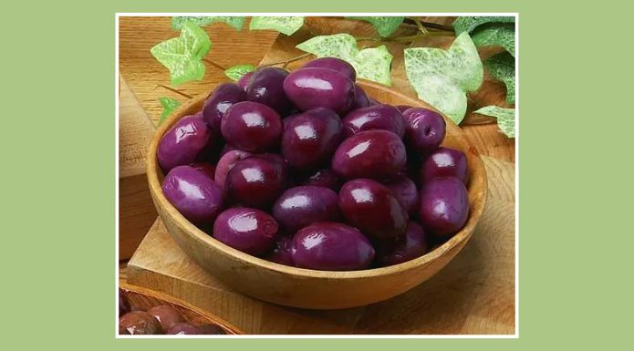 Alfonso olives in a wooden bowl.