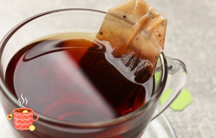 brewing cup of tea with tea bag in hot water