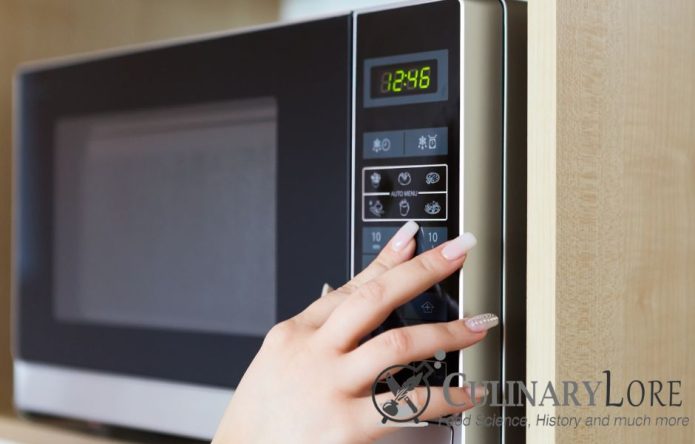 woman using microwave ovens settings
