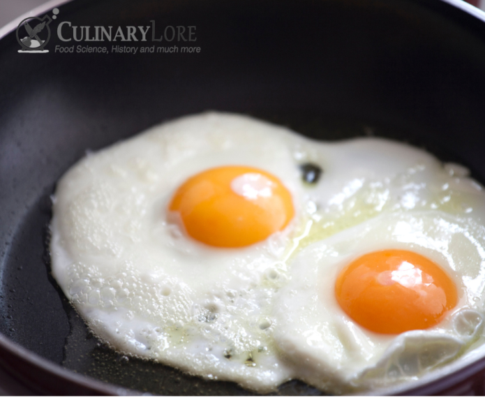 fried eggs sunny side up in pan
