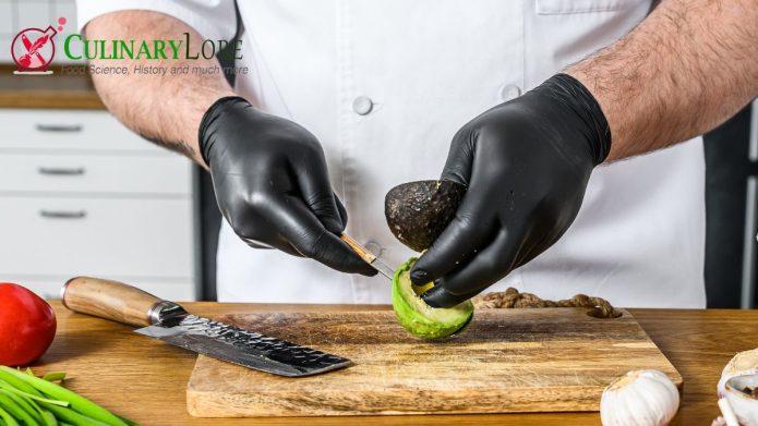 chef wearing food prep gloves while working with ingredients
