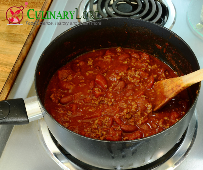 big pot of chili heating on the stove