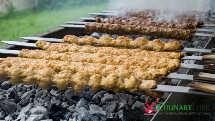 skeh kebabs on grill with metal skewers