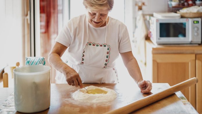 Typical romantic vision of the Italian grandmother making the daily fresh pasta.