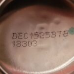 sell-by date stamped on the bottom of Coca-Cola can