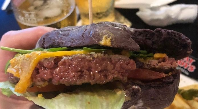 Impossible Bleeding Burger, plant-based burger by Impossible Foods served in restaurant
