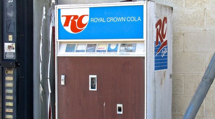 Vintage Royal Crown Cola vending machine displaying the RC logo and Royal Crown Cola branding